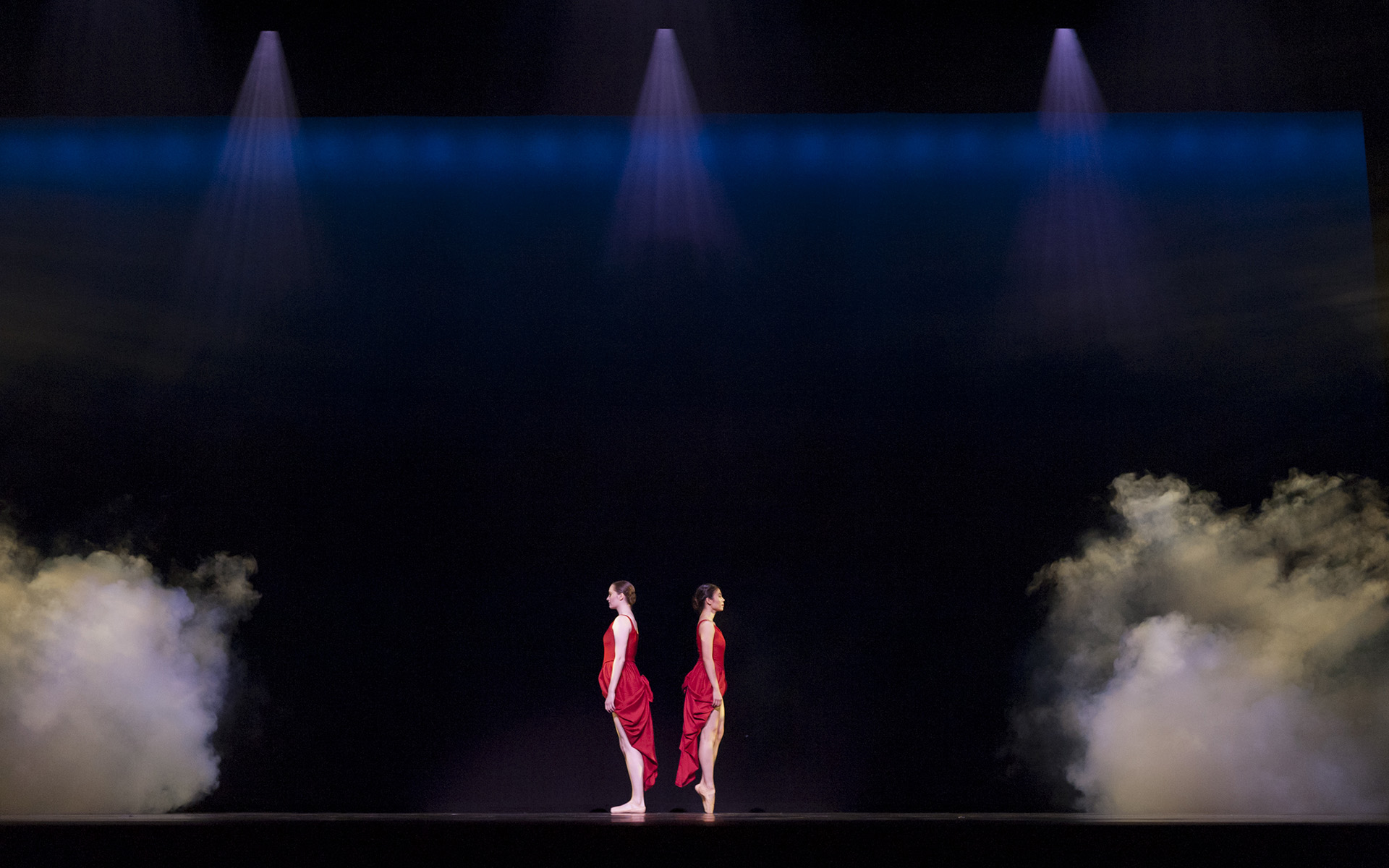 Dance Gala 2017 photo. Two female dancers in red dresses, ballet.