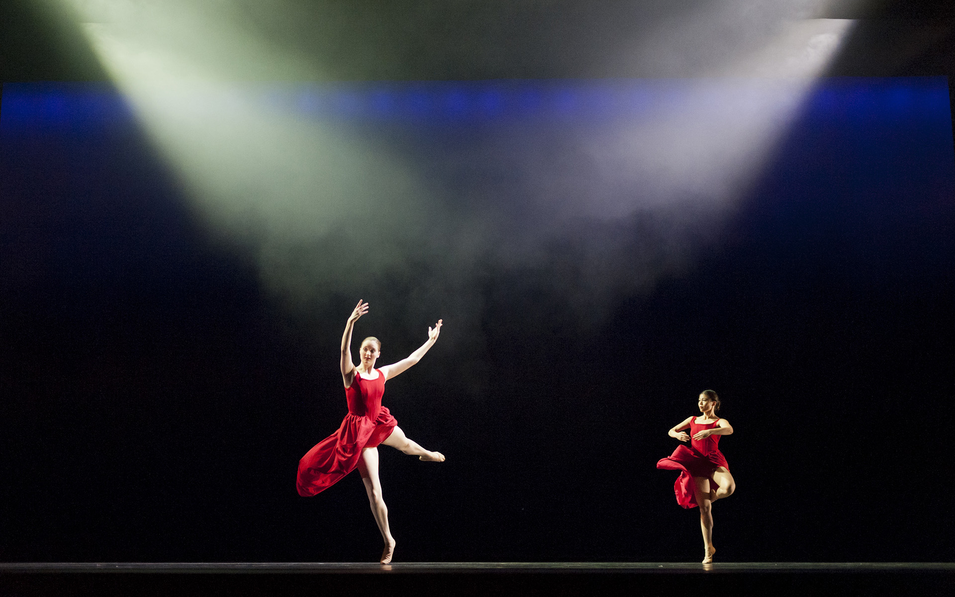 Dance Gala 2017 photo. Two female dancers in red.