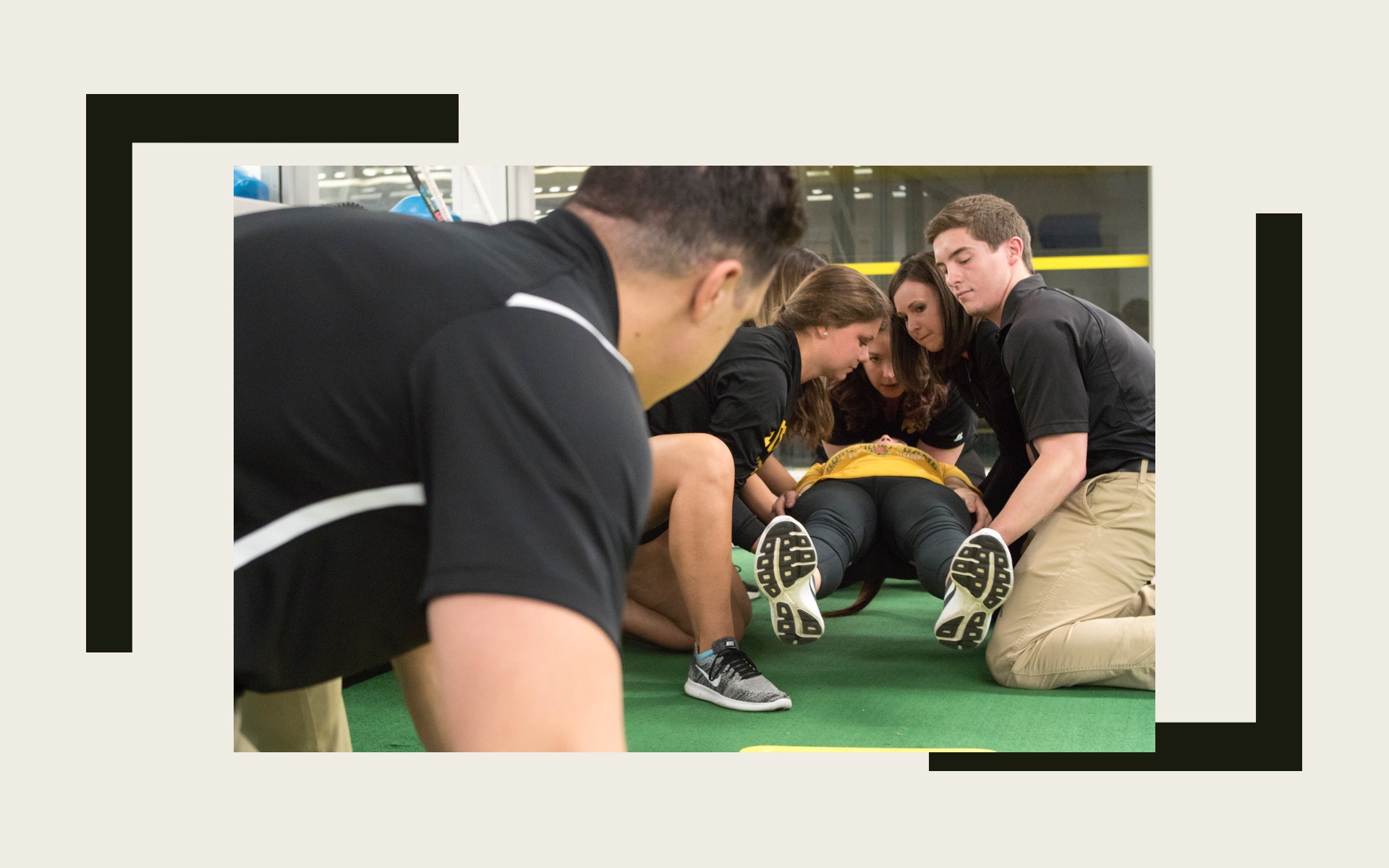Students and faculty practicing spine boarding lifts