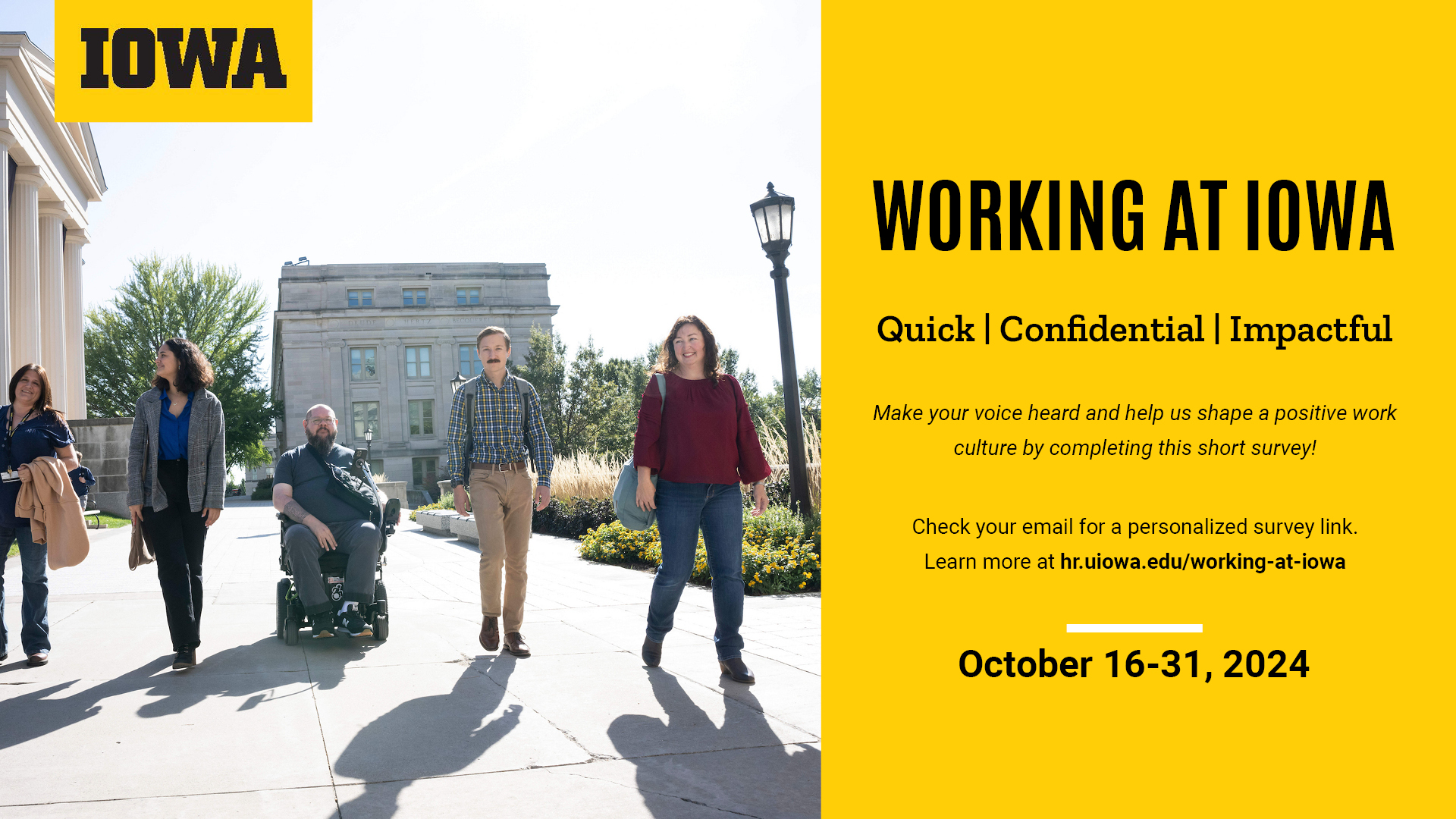 A photo showing 5 people at the University of Iowa walking together.